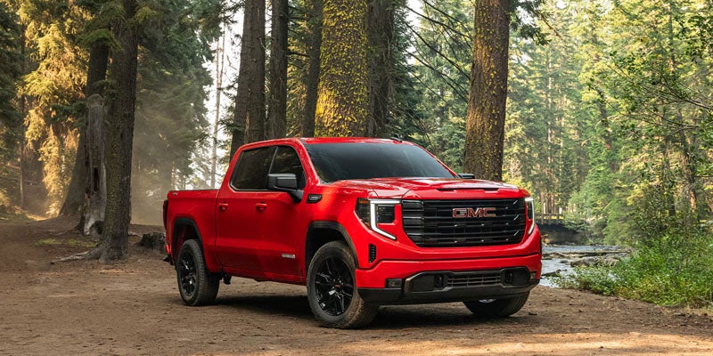 2026 GMC Sierra 1500 pickup truck driving through a forest trail near Clinton, NC