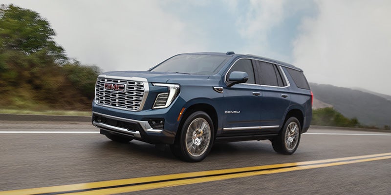 Front three-quarter view of the 2026 GMC Yukon highlighting its premium SUV styling