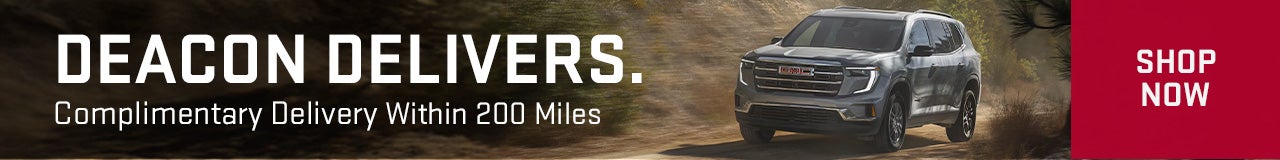 Silver Acadia driving on dirt road